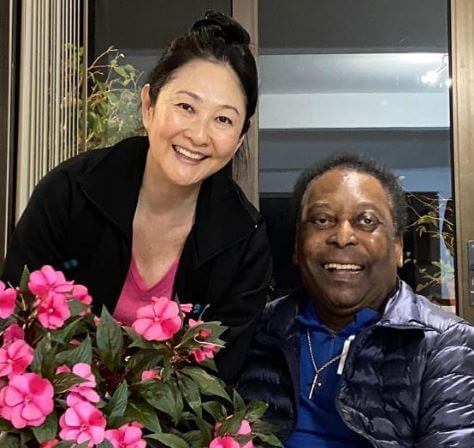 Celeste Nascimento father Pele with his current wife.